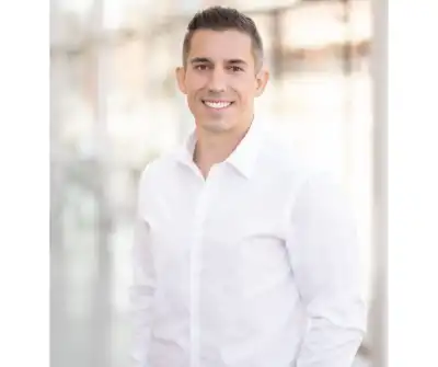 Photo of a man in a white shirt